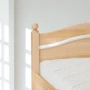 Kép 2/5 - 304G – Ágyneműtartós borovi fenyő ágy 140x200 cm ívelt gombos fejvég – részlet – Fenyőbútoros