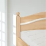 Kép 2/5 - 309G – Ágyneműtartós borovi fenyő ágy 90x200 cm ívelt gombos fejvég – részlet – Fenyőbútoros
